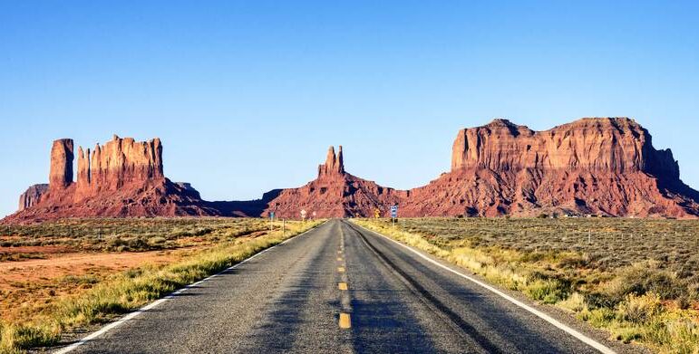 panoramic view of long road at Monument Valley